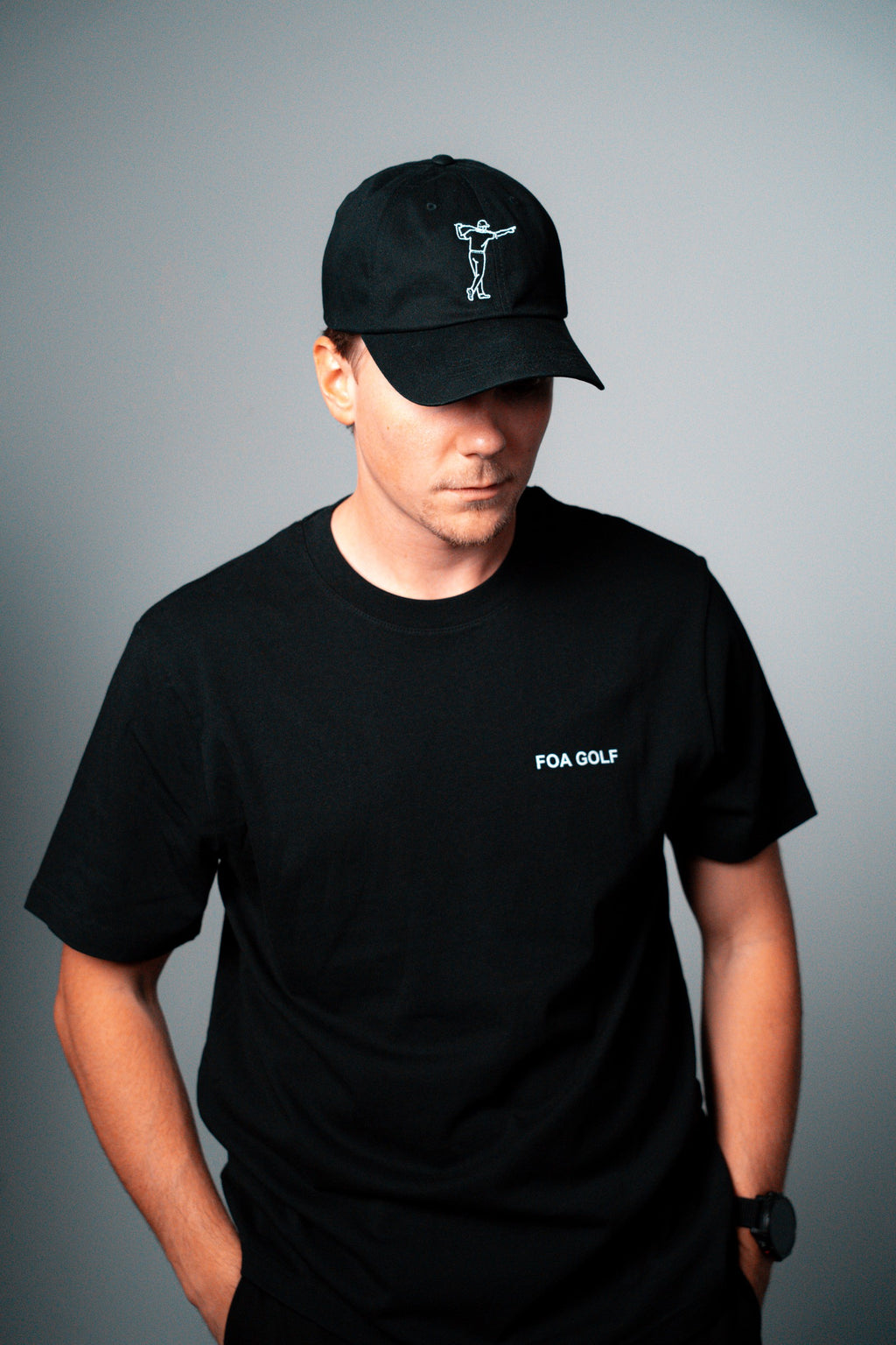FOA black cap, worn on a model.