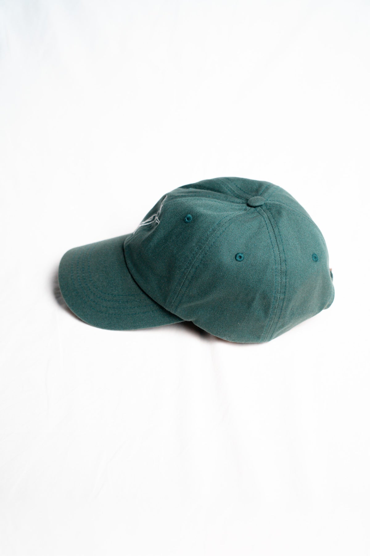 FOA green cap, side view.