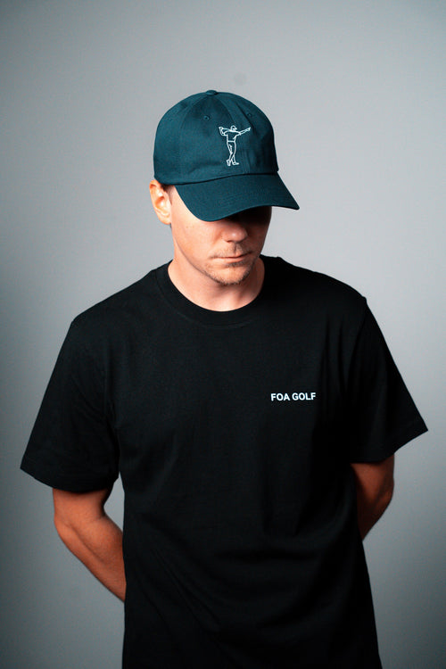 FOA navy cap, worn on a model.