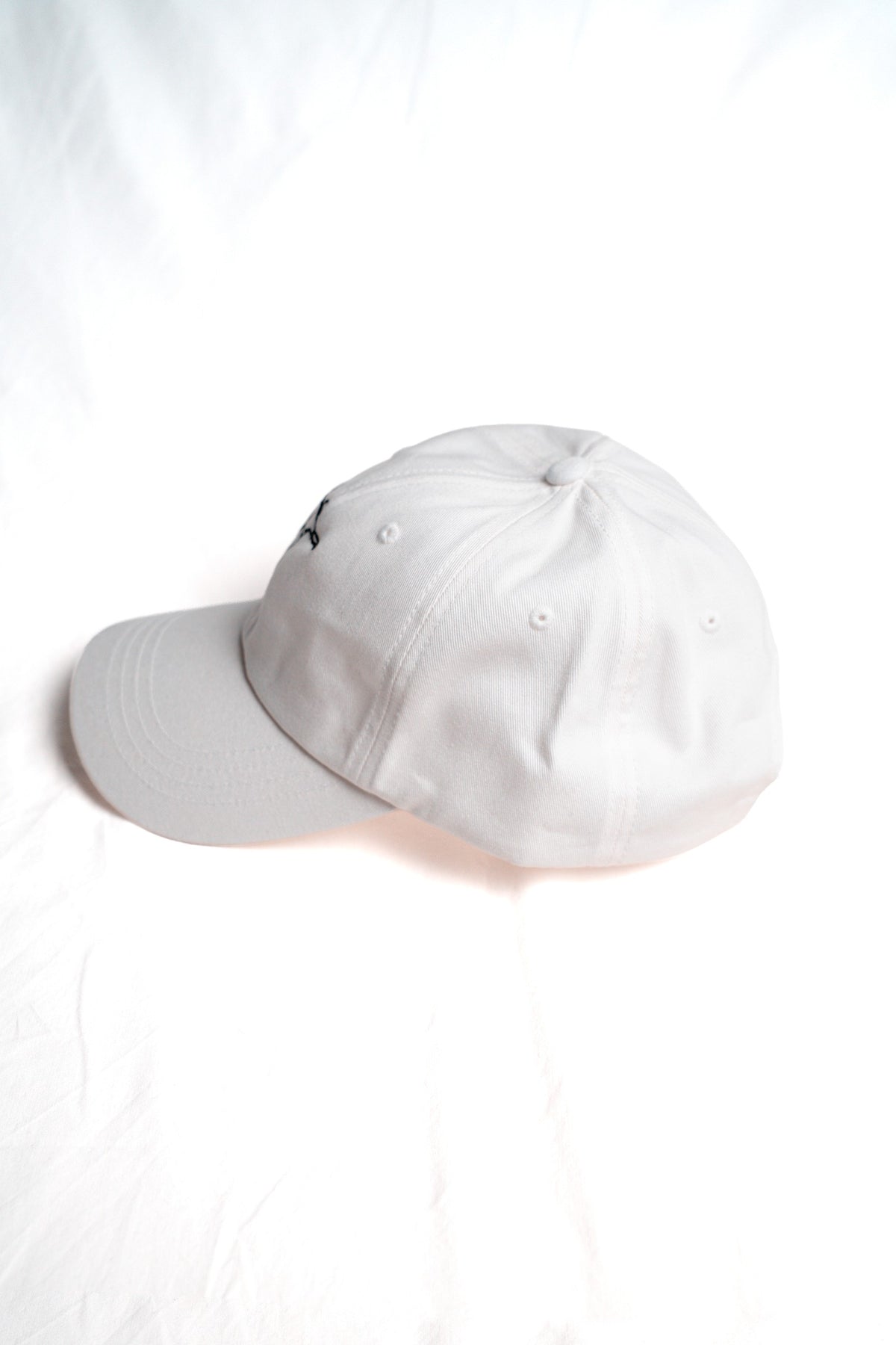 FOA white cap, side view.