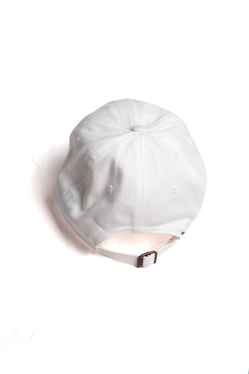 FOA white cap, rear view showing the adjustable strap and buckle.
