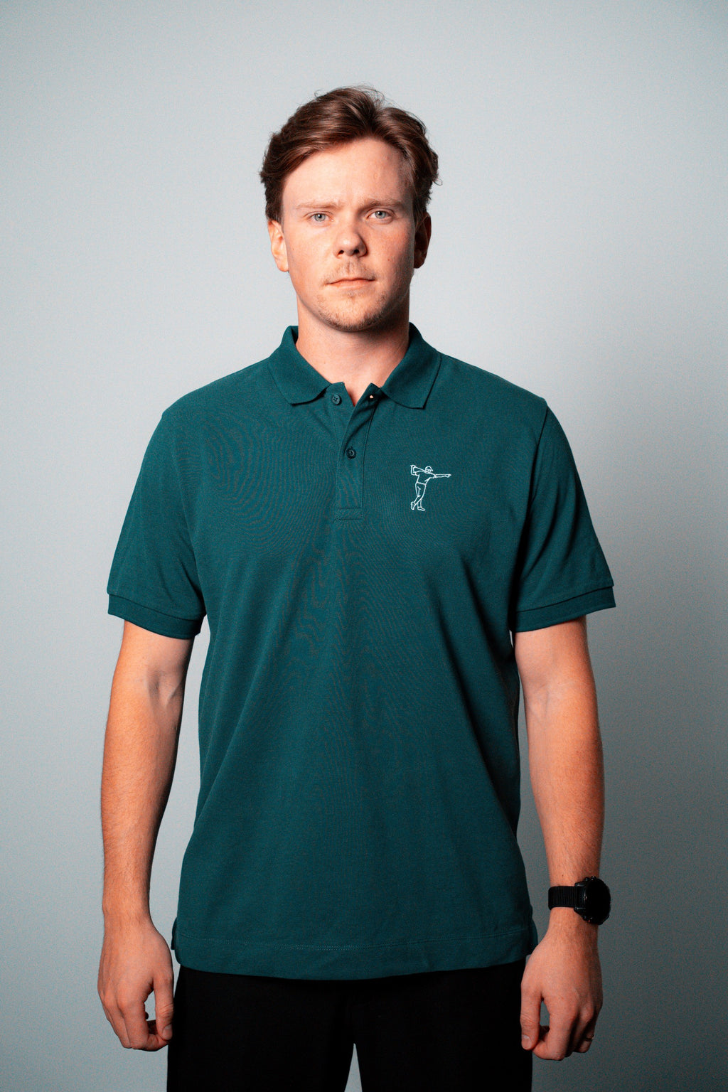 FOA green polo, front view worn on a model.
