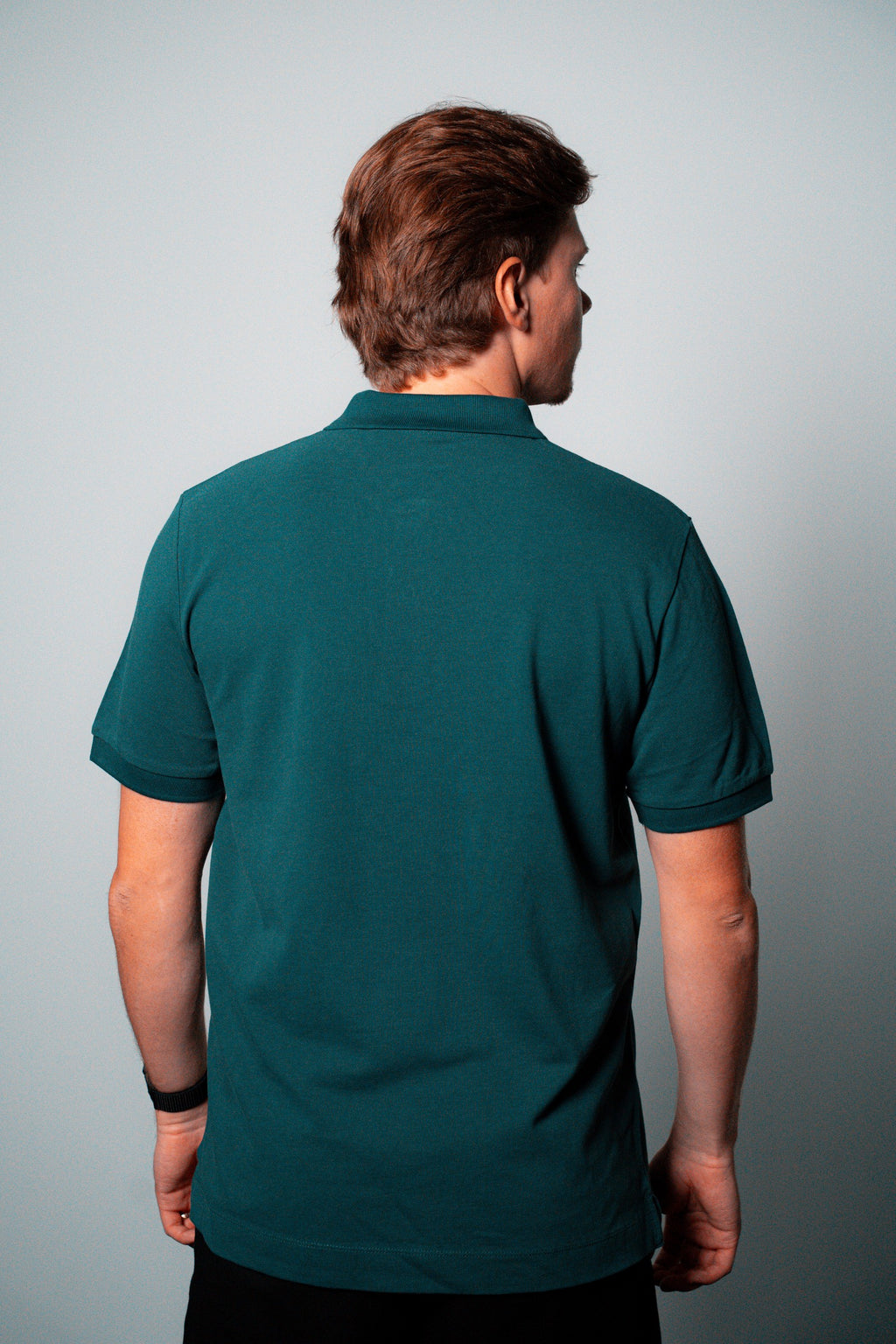 FOA green polo, back view worn on a model.