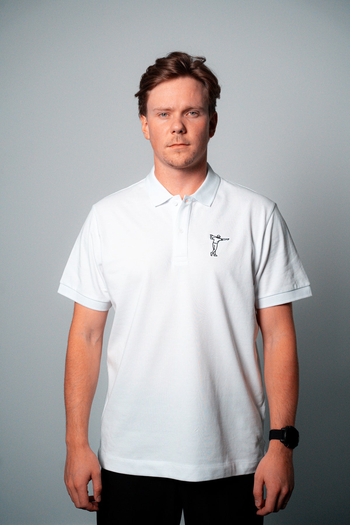 FOA white polo, front view worn on a model.
