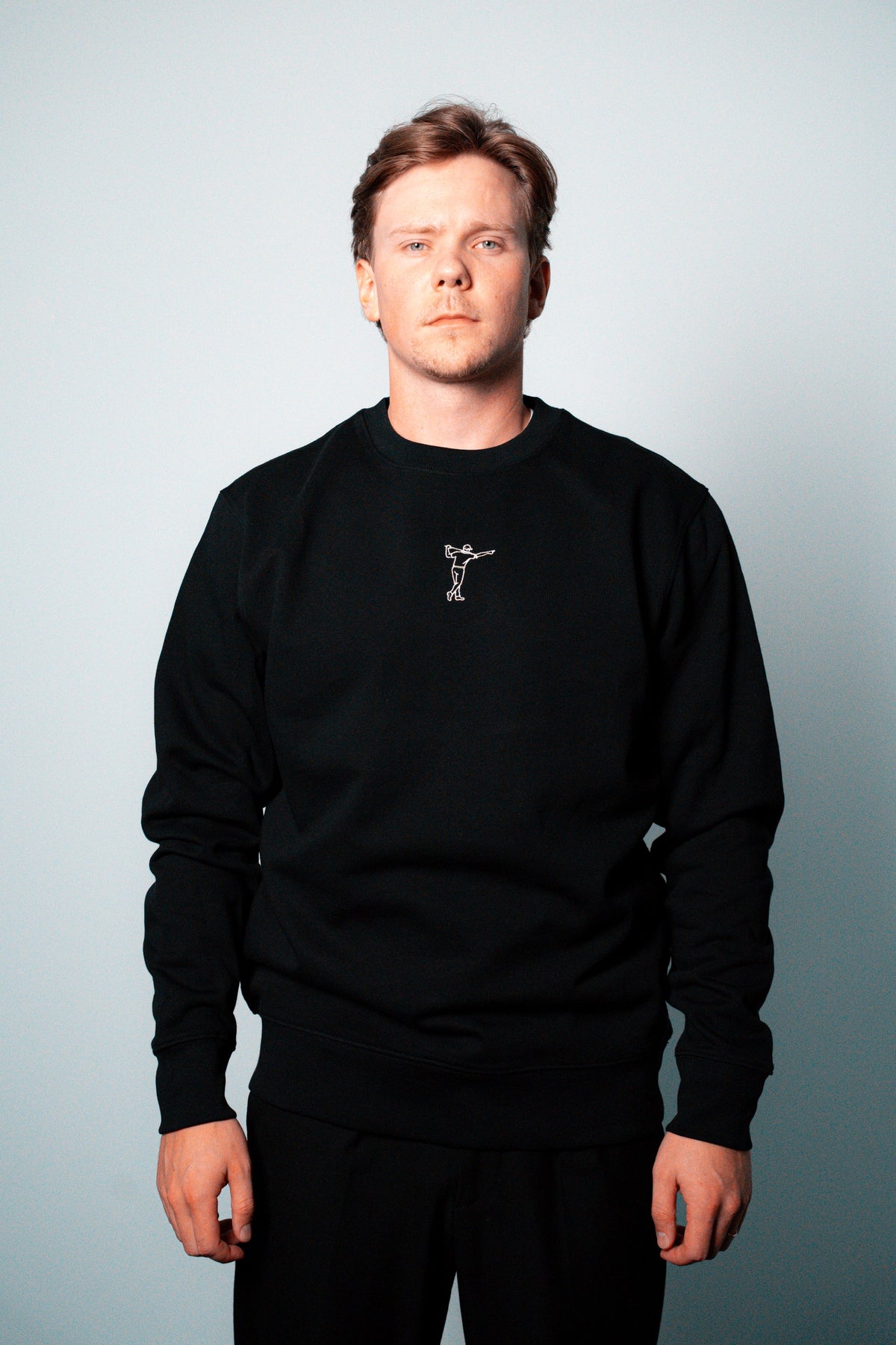 FOA black sweatshirt, front view worn on a model.