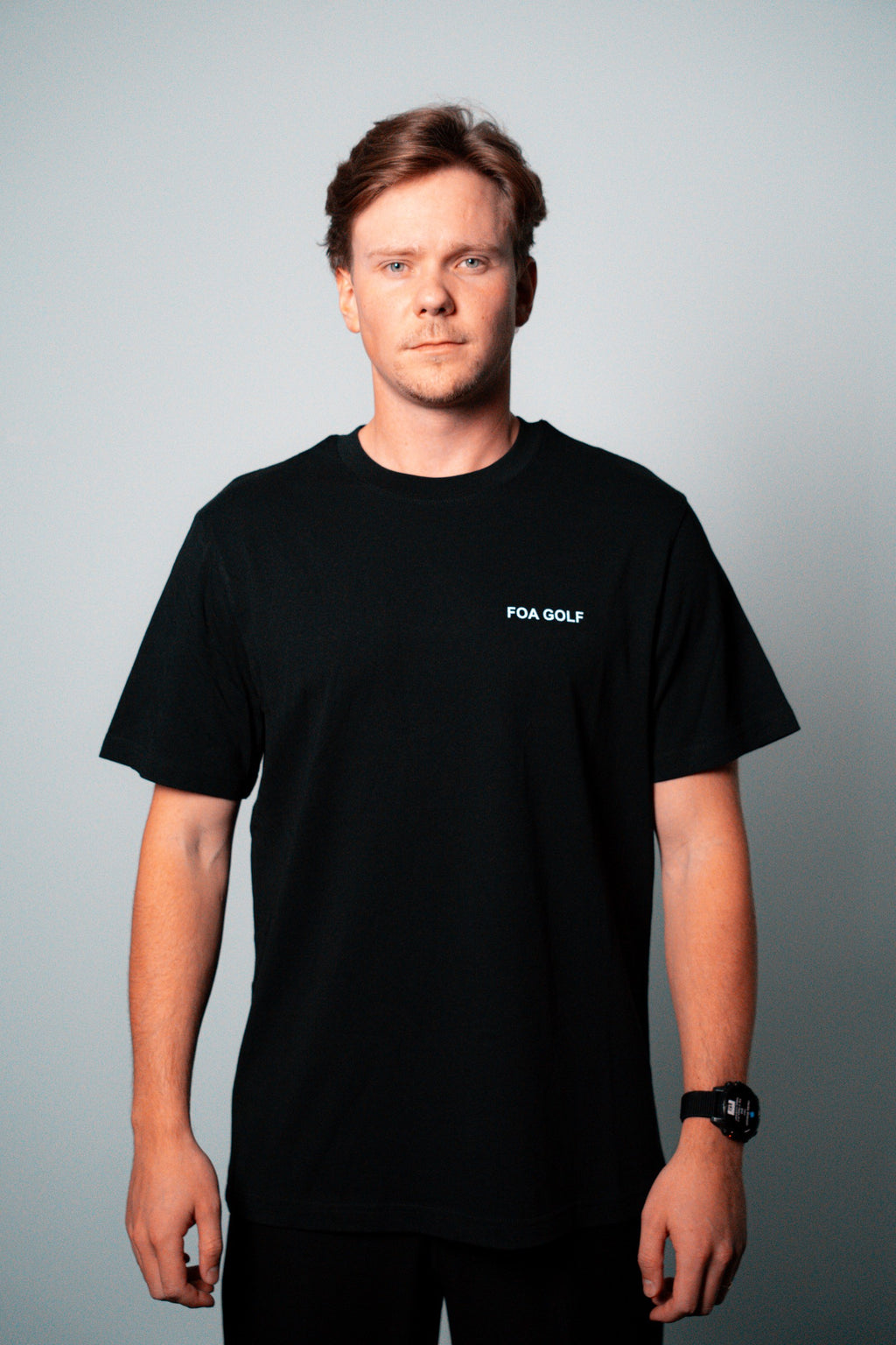 FOA black t-shirt, front view worn on a model.