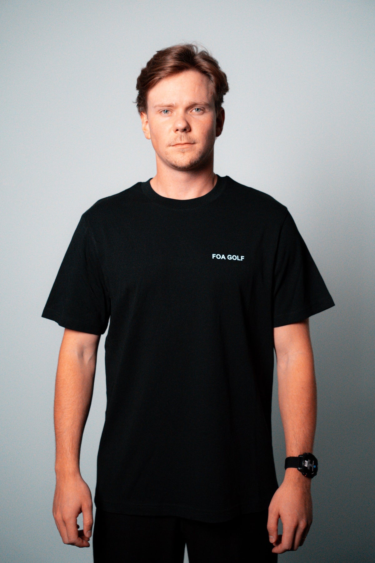 FOA black t-shirt, front view worn on a model.